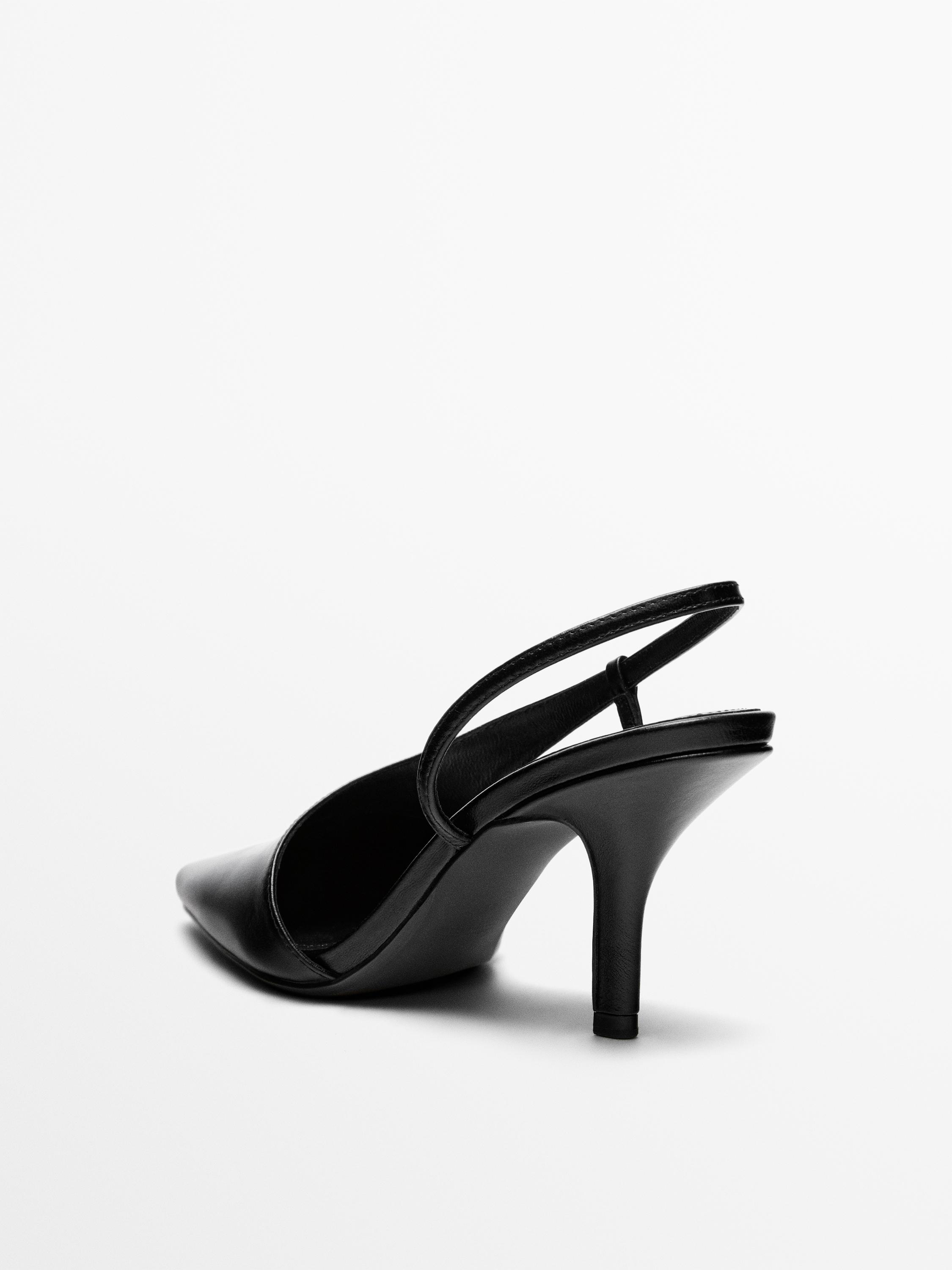 Asymmetric high-heel shoes